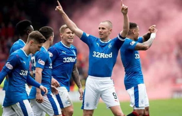 The Rangers kit with 32Red sponsorship visible on the front.