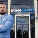 CEO Conor Gray in front of a BoyleSports shop.