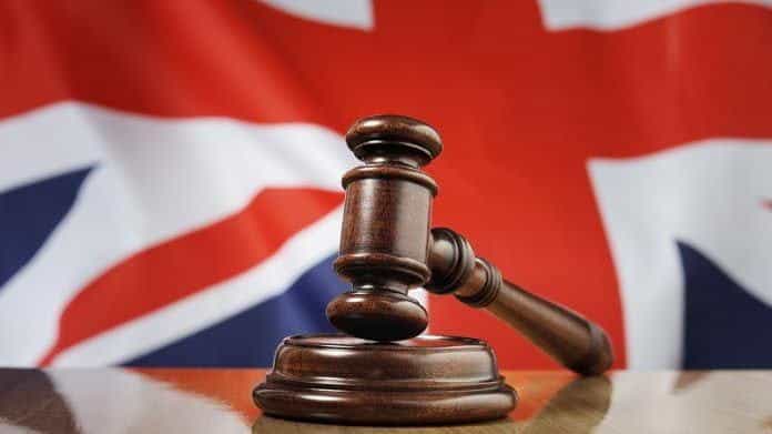 A gavel with a Union Jack.