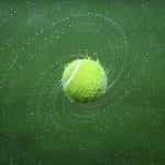 Tennis ball spinning.