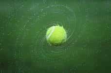 Tennis ball spinning.