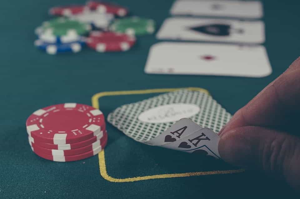 Poker chips and cards on a table.