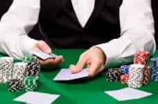 A casino croupier dealing cards.