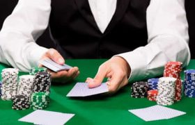 A casino croupier dealing cards.