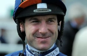 Robert Winston’s face in full jockey gear.