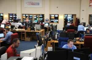 Employees sit at desks, looking at computers, in Betfred’s offices.