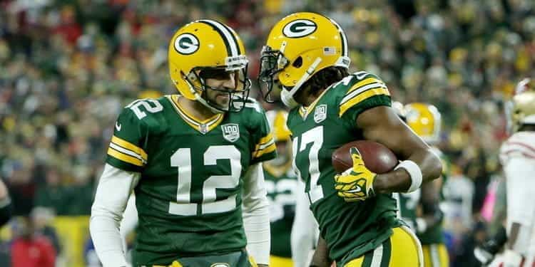 Two members of the Green Bay Packers in the middle of the game.