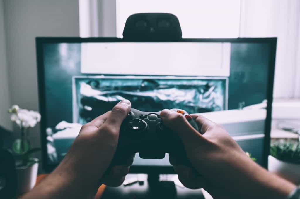 Close up of a person playing a video game.