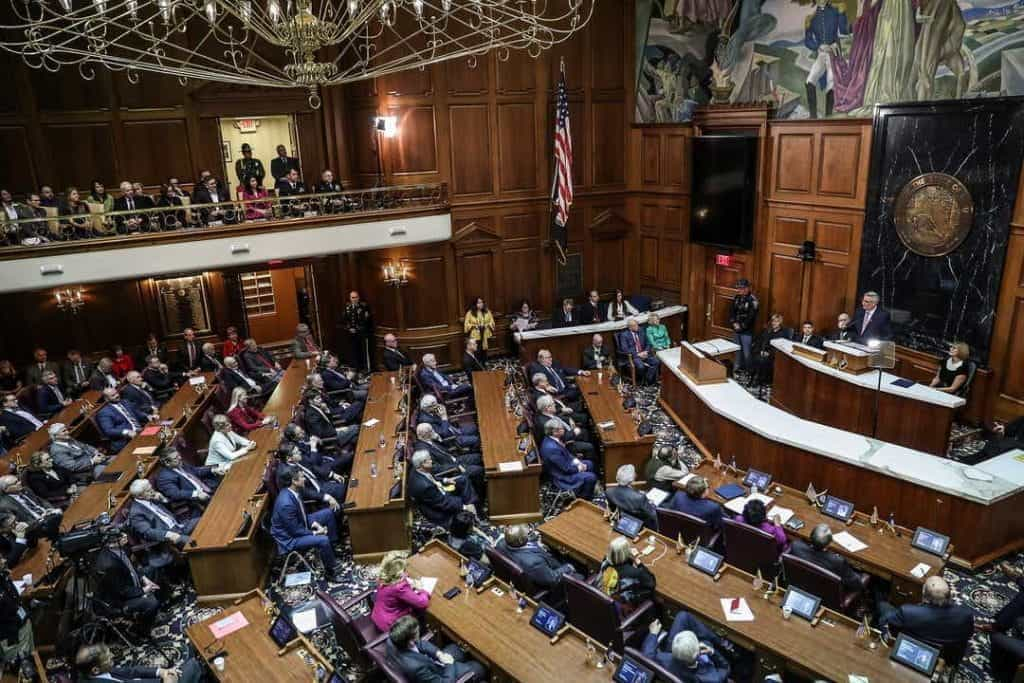 Governor Eric Holcomb addresses state representatives in the Indian General Assembly.