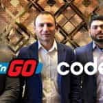 Executives from Play’n GO and Codere smile with both logos positioned in front of them.