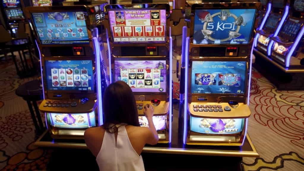 Three slot machines in Manila.
