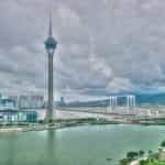 The Macau tower seen from a distance on a cloudy day.