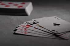 Playing cards fanned out on a table.