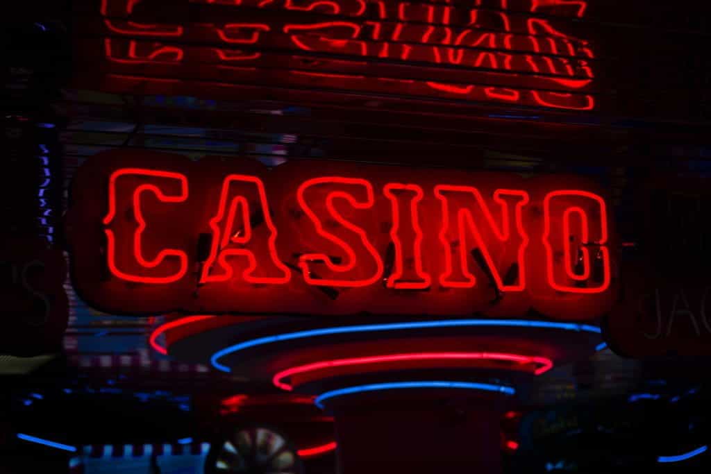A neon red sign that reads casino.