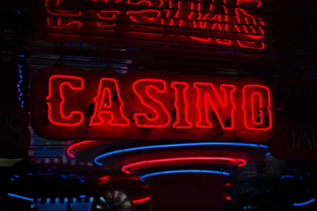 A neon red sign that reads casino.