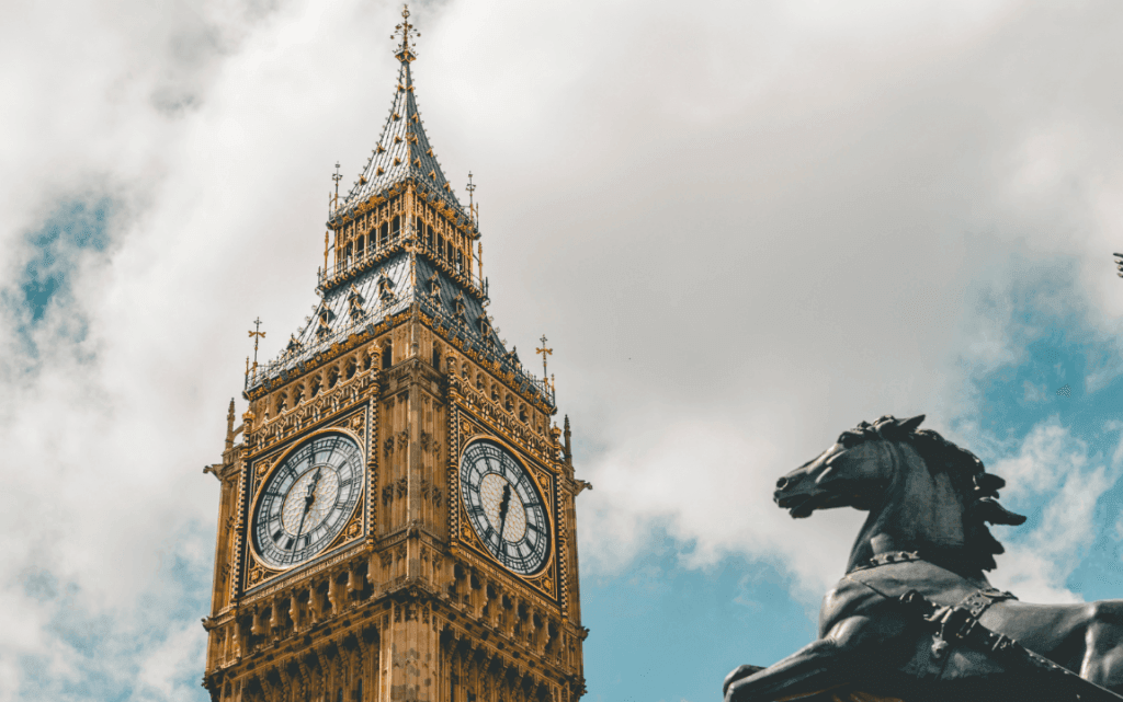 Looking upwards at Big Ben and the Boadicea statue in London.