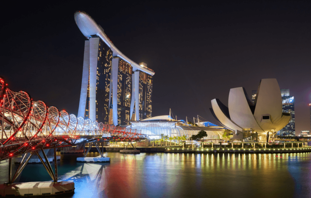 The Marina Bay Sands seen at night from the water. 
