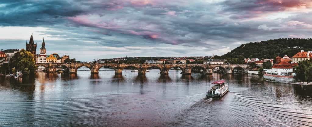 A bridge spanning a river in Prague, Czech Republic. 
