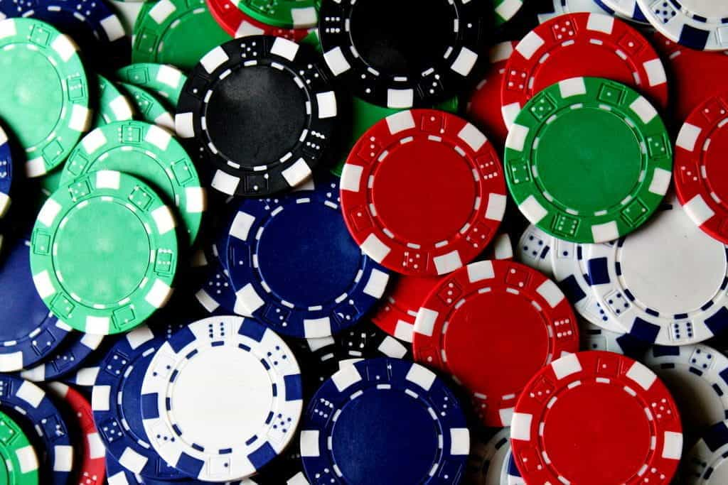 A pile of various colors of poker chips. 