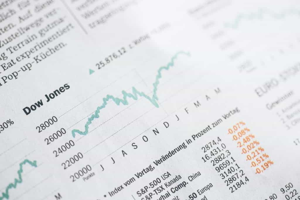 A newspaper shows a graph of stocks rising and falling.