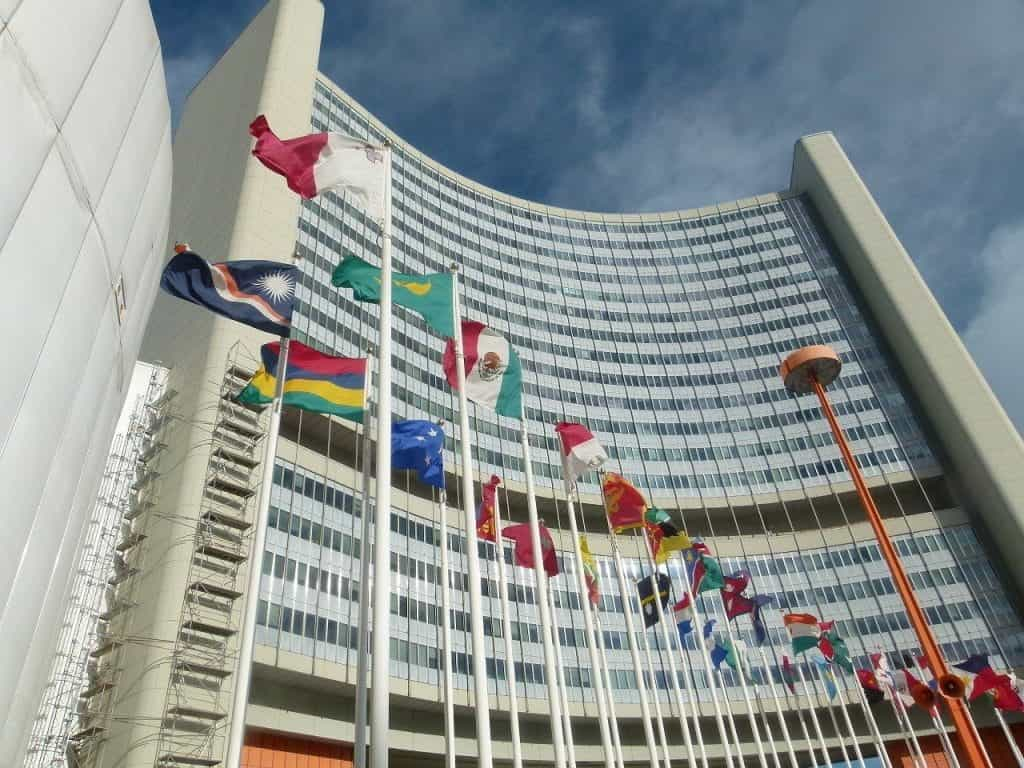 A corporate building in Vienna surrounded by flags.