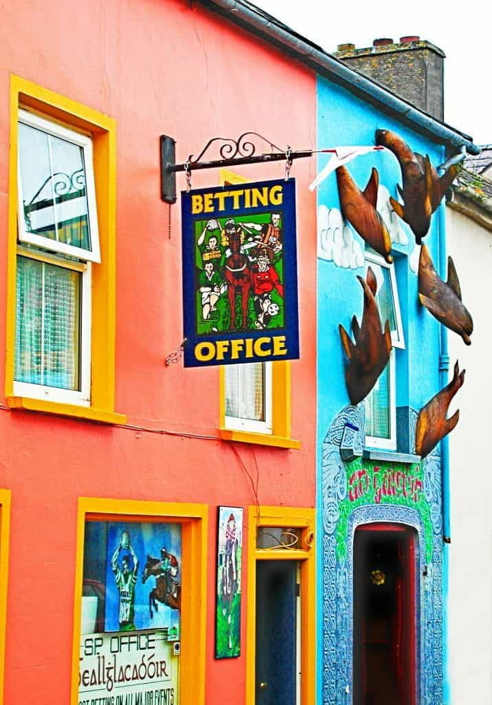 A building with a "betting office" sign outside.