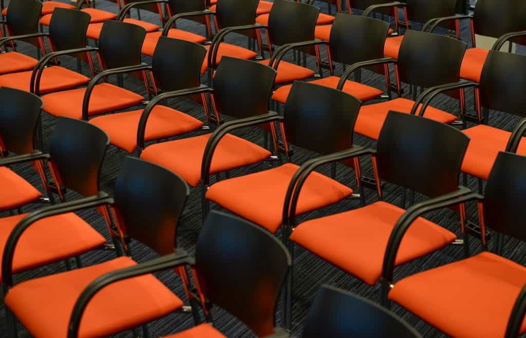 Rows of empty seats lined up, ready for an audience.