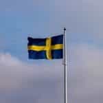 Swedish flag on a flagpole.