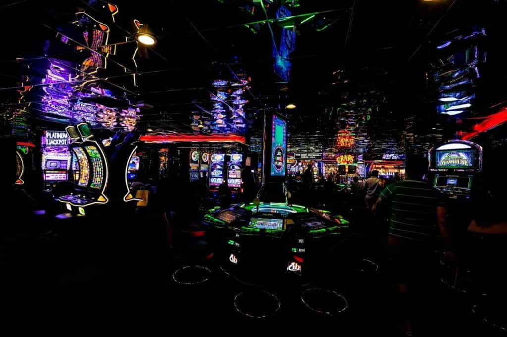 Casino style arcade games in dark arcade.