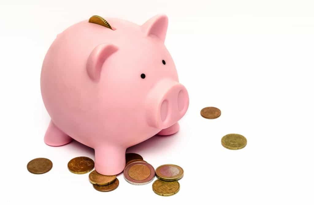 A piggy bank, with coins. 