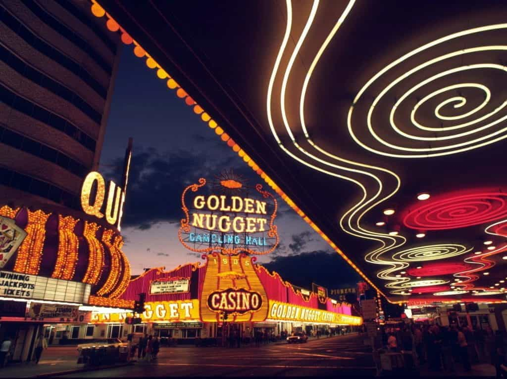 The bright, colorful lights of Las Vegas casinos, including the Golden Nugget Gambling Hall.