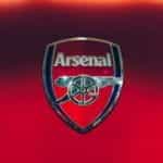 he Arsenal Gunners emblem, against a red backdrop.