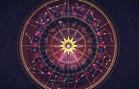 An astrological chart laid over a roulette wheel.