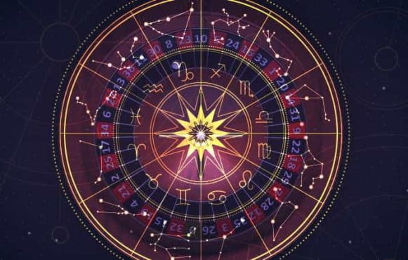 An astrological chart laid over a roulette wheel.
