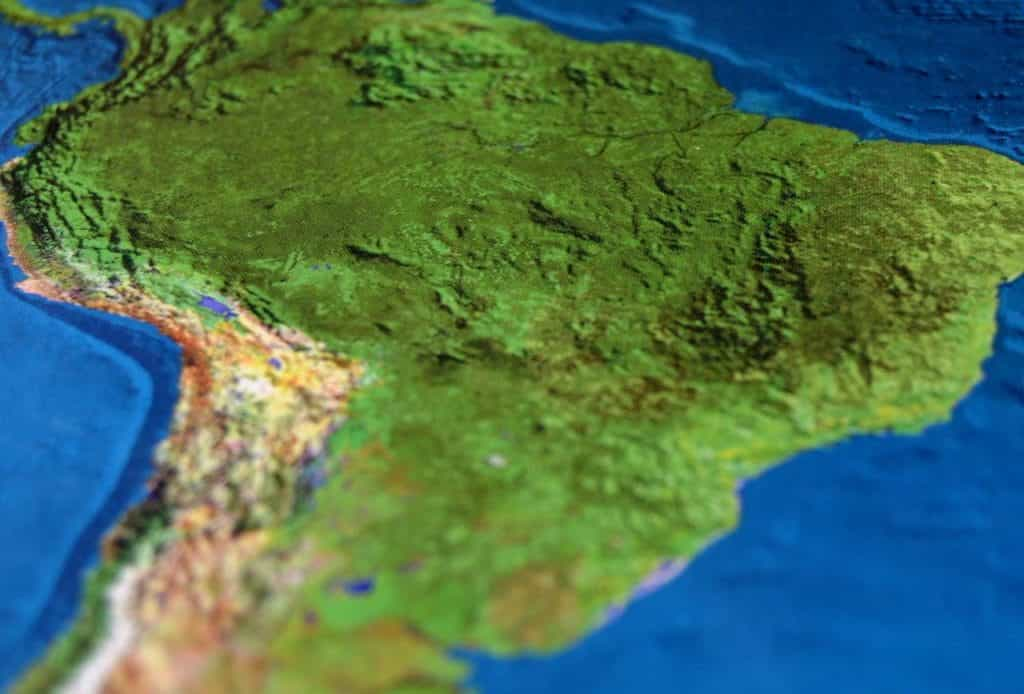 A close-up of South America on a map emphasizing the texture and realistic colors of the terrain.