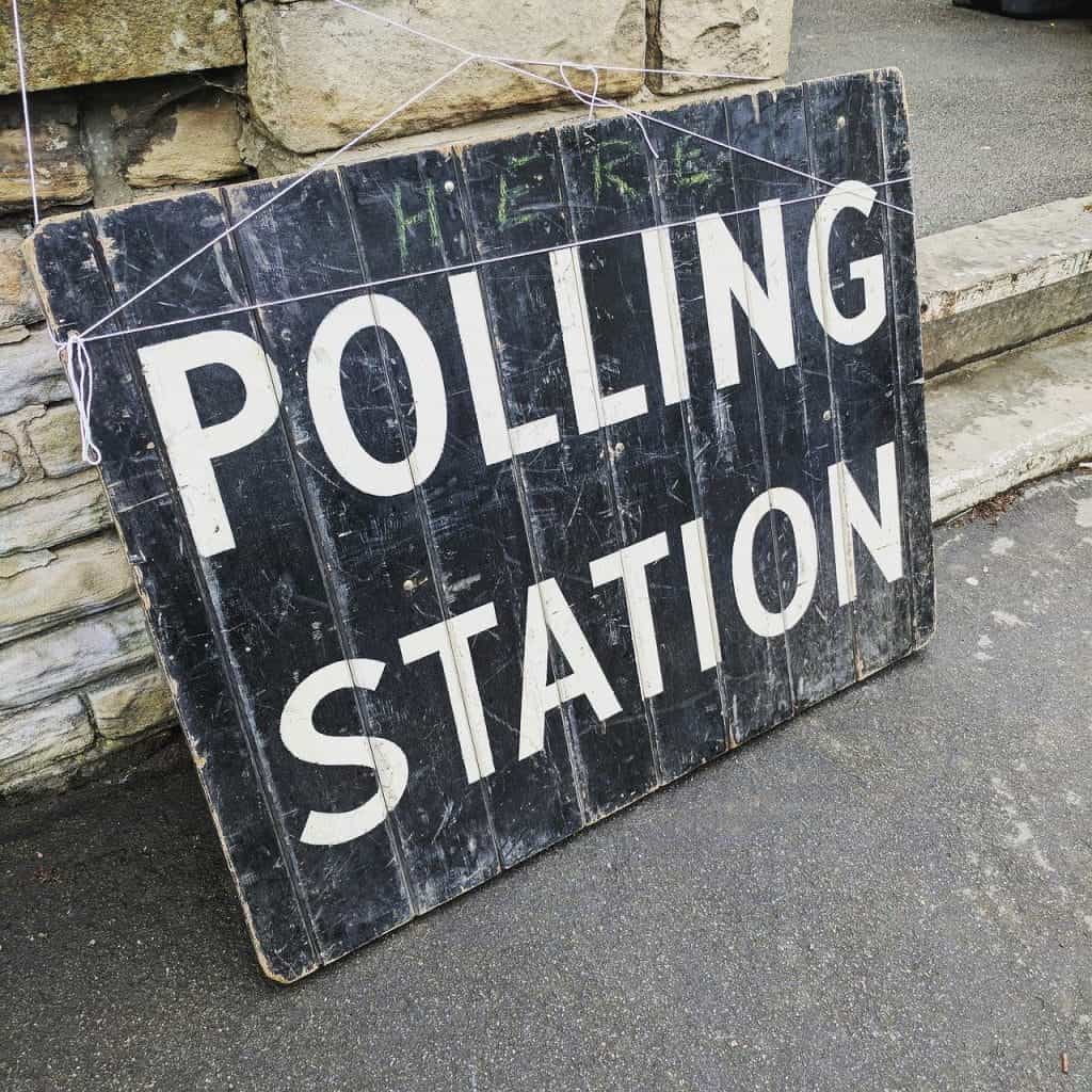 A sign for a polling station during an election.