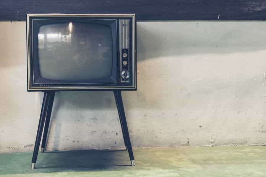 An old TV on a stand.