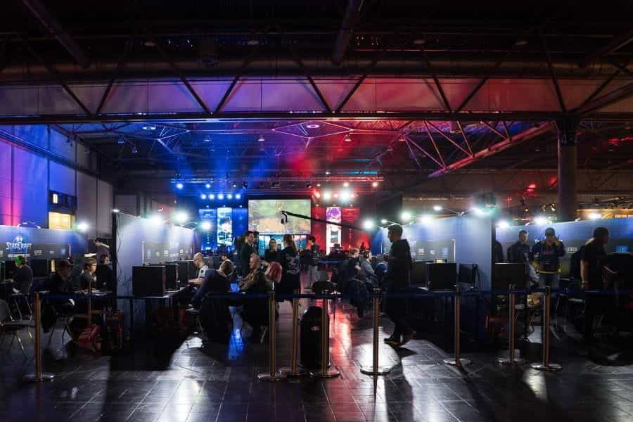 An eSports tournament is underway with players competing against each other on computers.