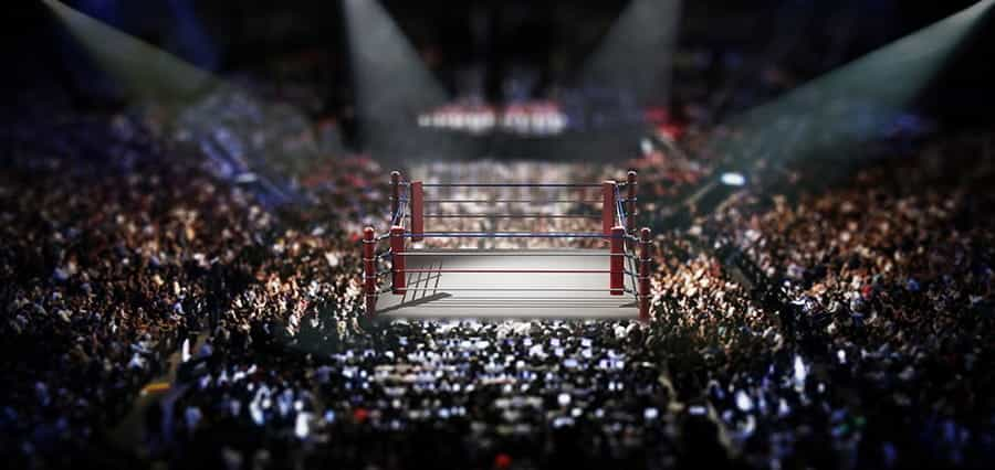 A boxing ring in a packed out venue.