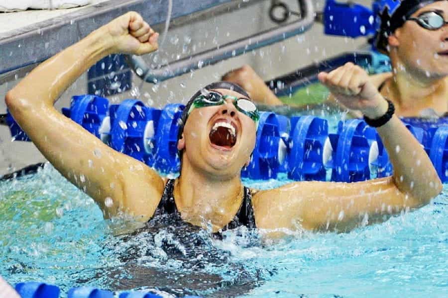 An Olympic swimmer celebrating a win.