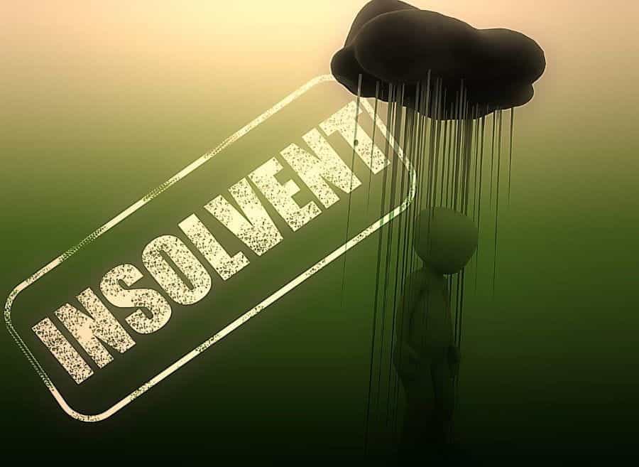 A raincloud hovers over a person, with the word INSOLVENCY stamped next to them.