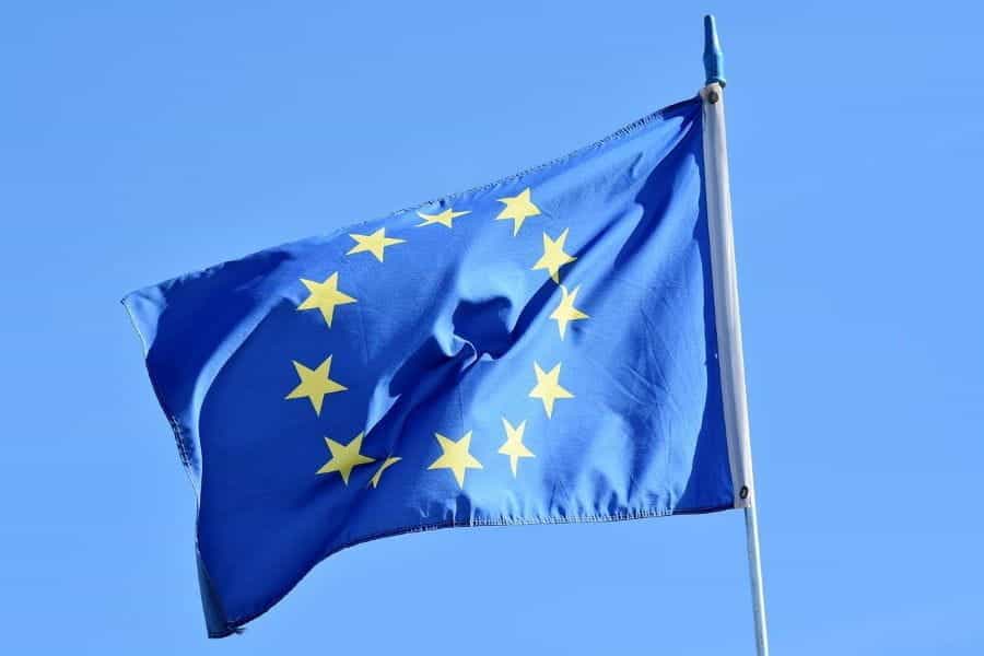 The European flag flying from a flagpole.