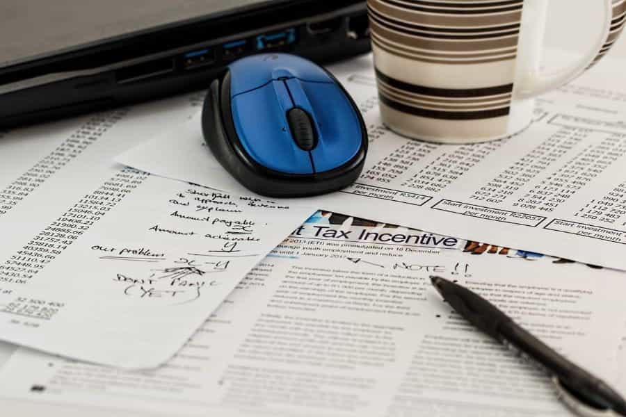 Financial statements and a pen.