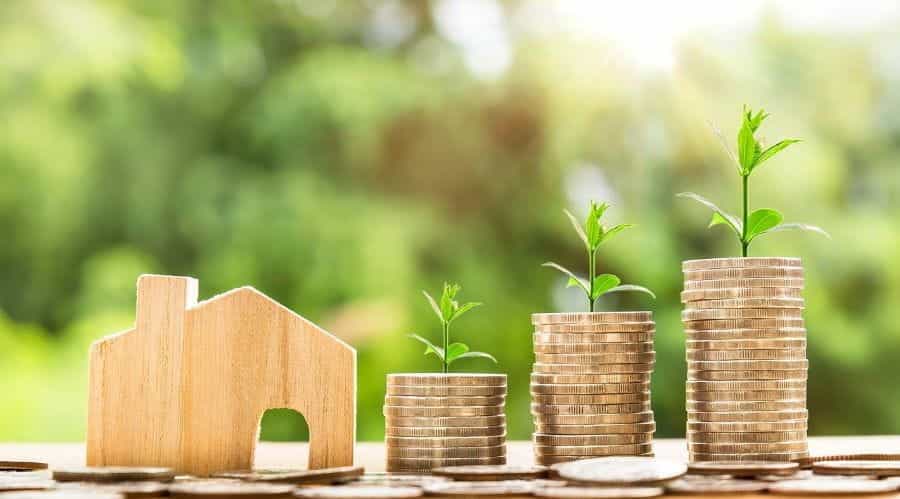 Housing price tranches represented by coins in piles.