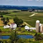 Farmland in Iowa with barn and silo.