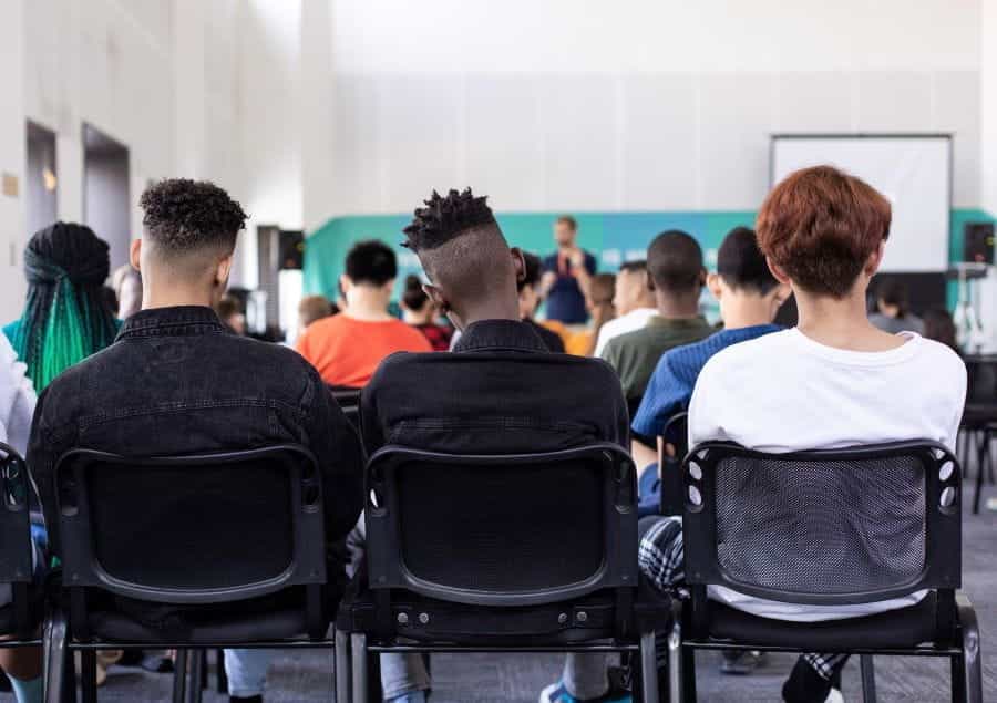 Young people being taught in a school classroom.