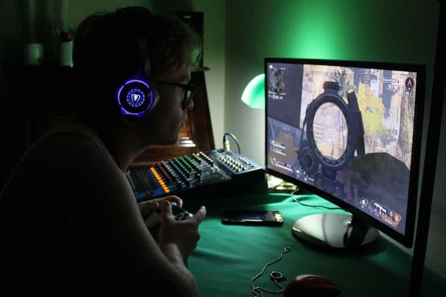 An e-sports gamer plays shooter game on Playstation.