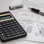 Balance sheet and calculator.