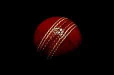 A red cricket ball.