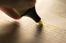 A person highlighting legislation.